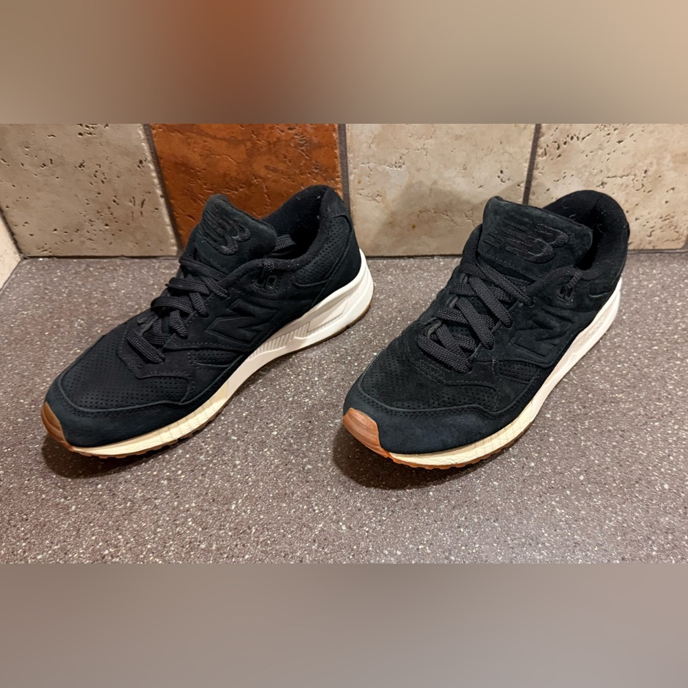 New Balance Black Suede Sneakers with Cream Soles and Brown Toe Accents